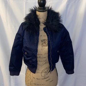 Coat with fur trim on around neck